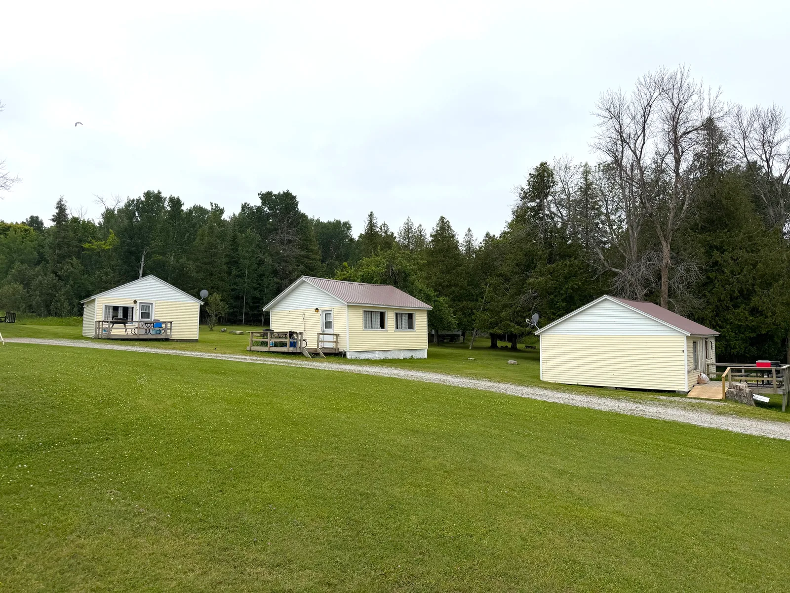 Three of the cabins across the resort lawn